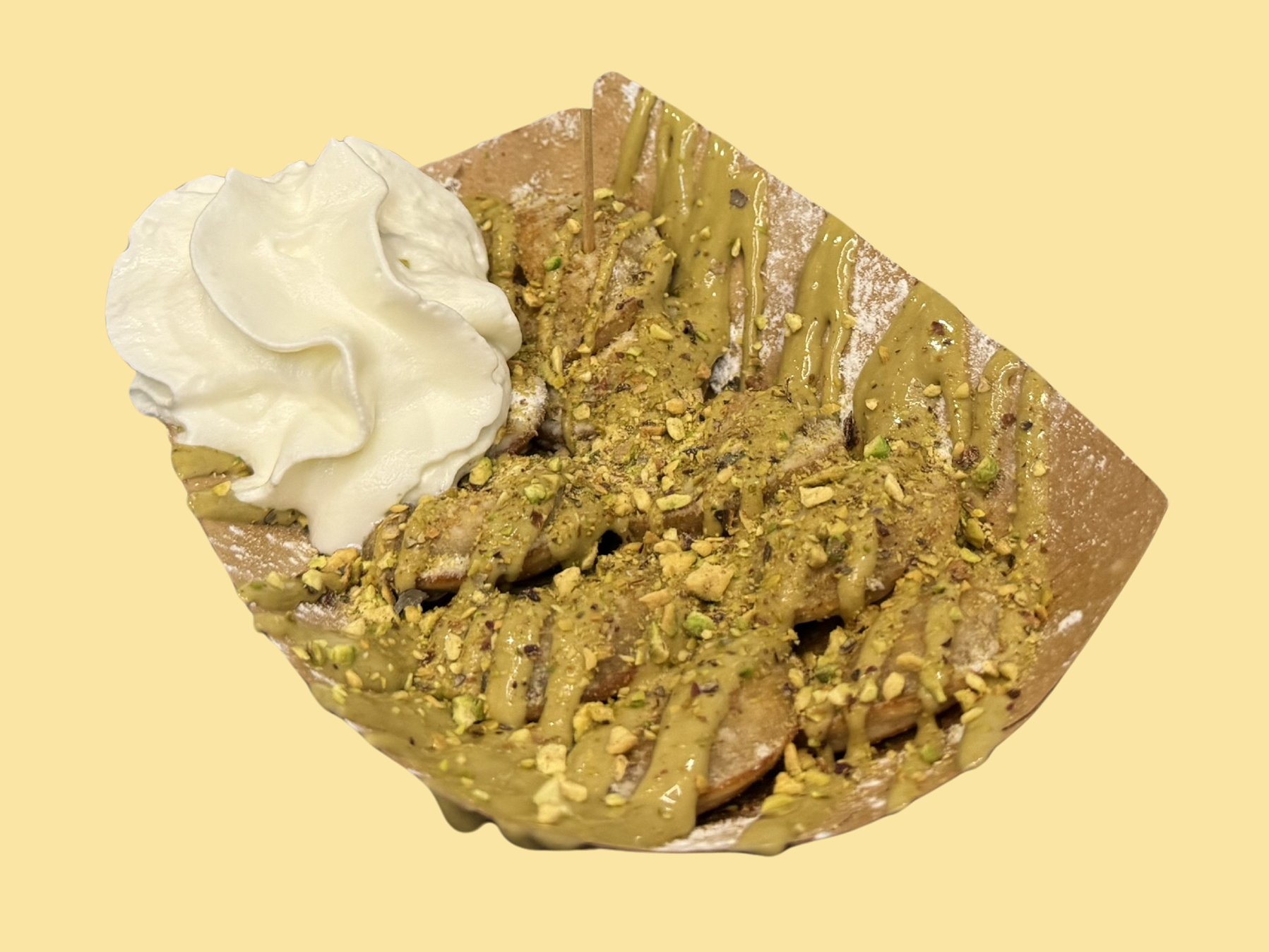 Poffertjes малка порция с пистачио топинг, натрошен шамфъстък, сметана